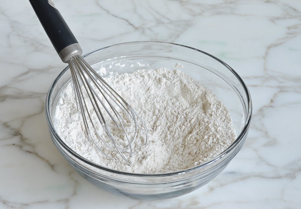 whisking dry ingredients for pumpkin pancakes