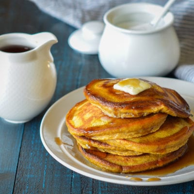 Stack of pumpkin pancakes on a plate.