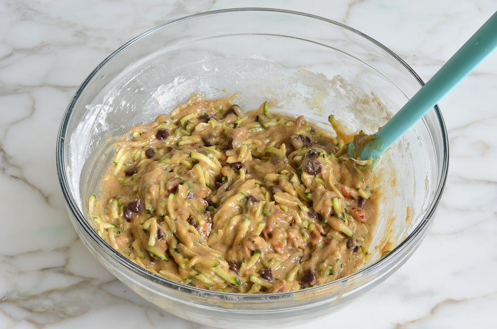 Zucchini chocolate chip muffin batter in a mixing bowl.
