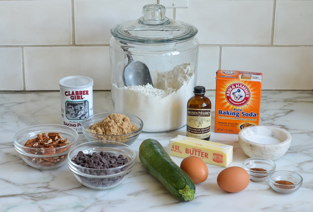Zucchini chocolate chip muffin ingredients including eggs, baking soda, and vanilla.