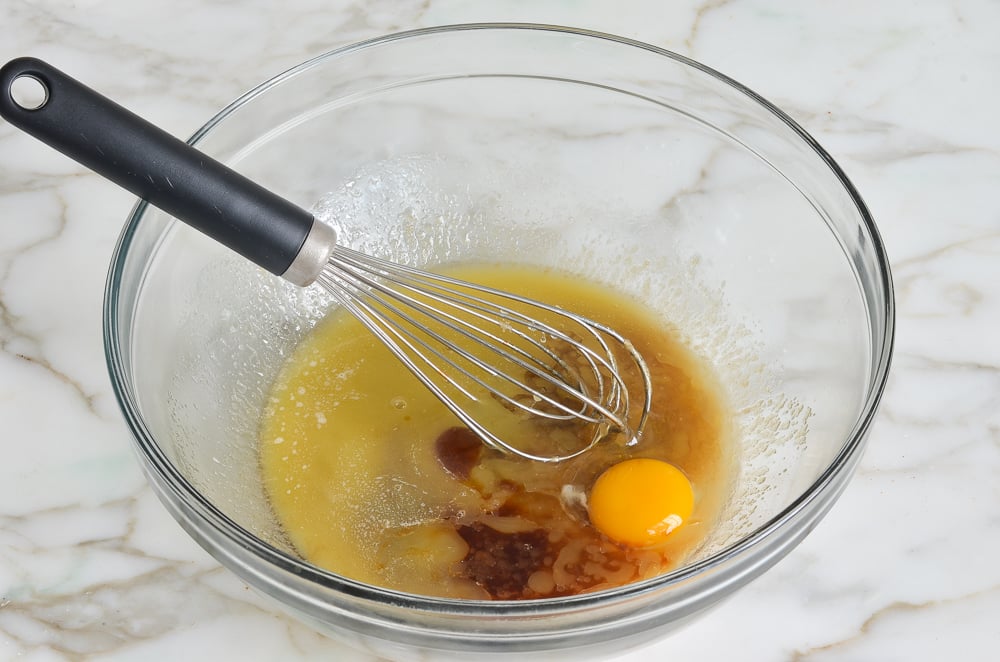 Whisk in a bowl of liquid ingredients with an egg.