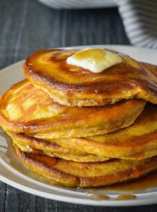 pumpkin pancakes stacked on plate