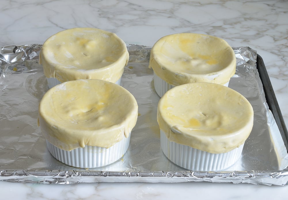 Ramekins topped with puff pastry.