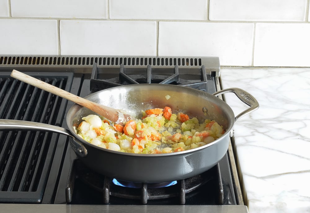 Vegetable and flour mixture in a skillet.