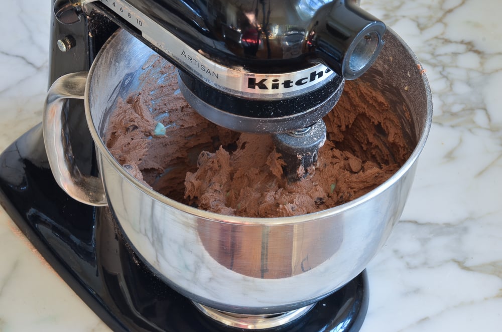 Cookie dough in a stand mixer.