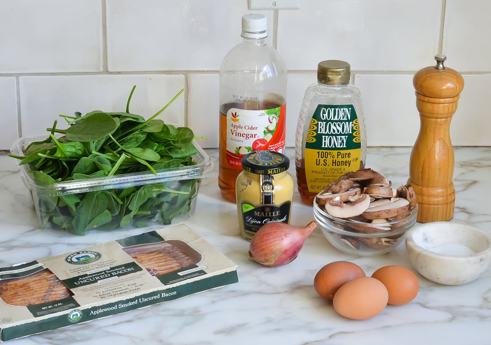 Salad ingredients including eggs, honey, and apple cider vinegar.