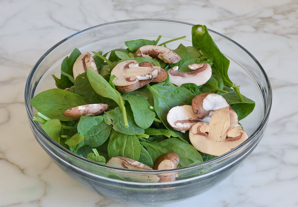 Bowl of spinach and mushrooms.
