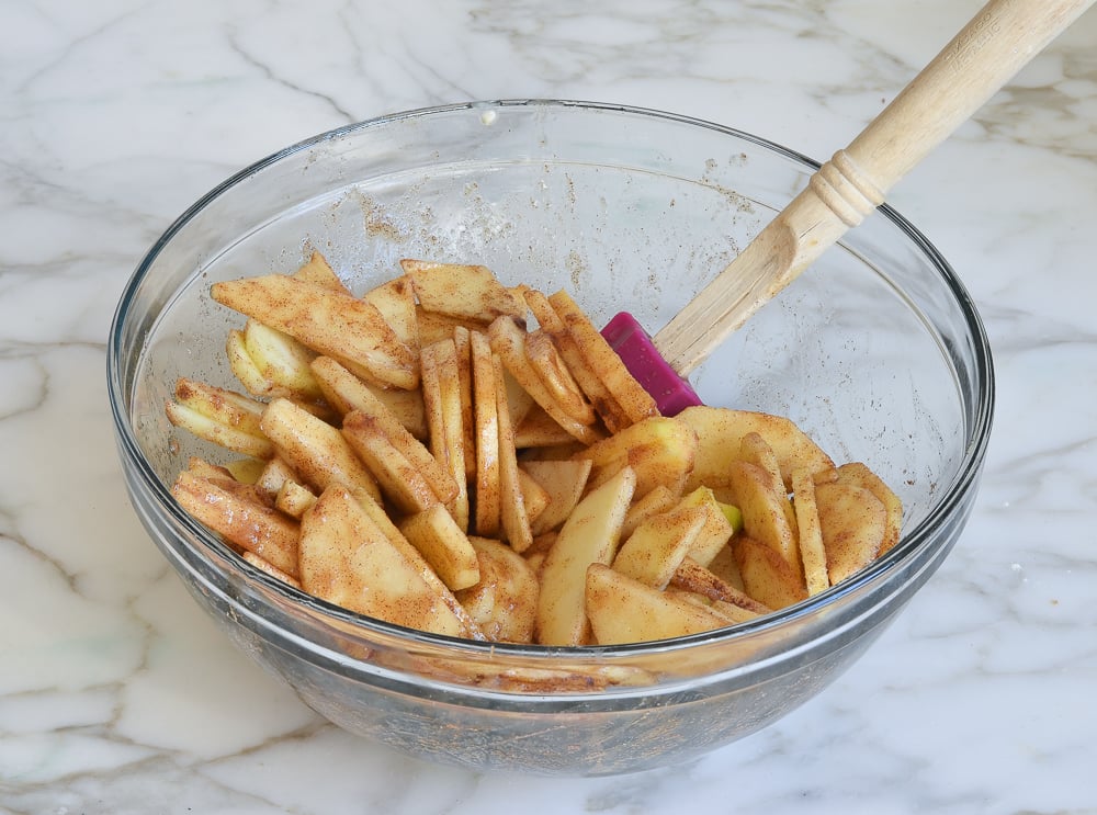 Apple slices covered in a sugar mix.