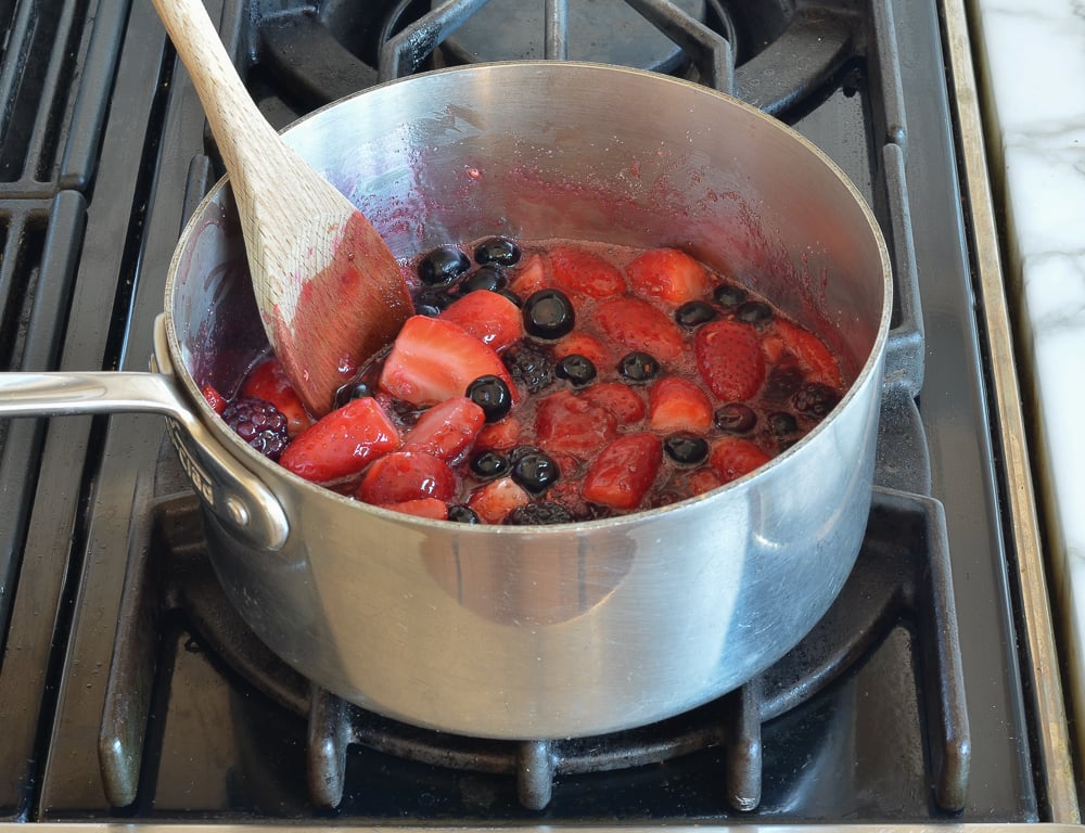 Berry, sugar, and lemon juice in a saucepan.