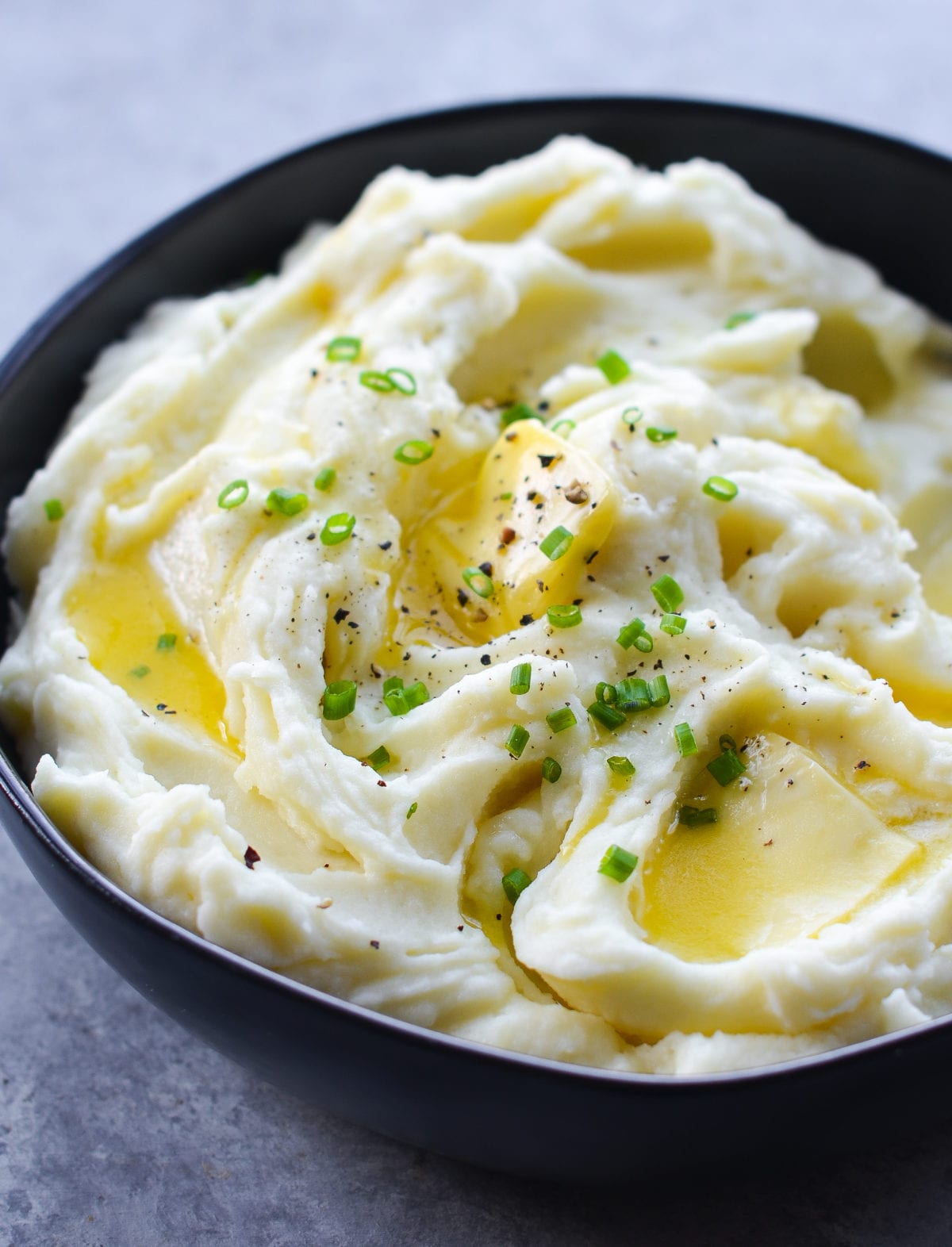 Butter melting into a bowl of mashed potatoes.