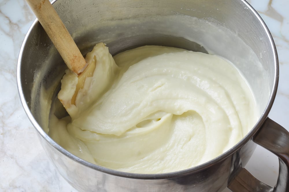 Spatula in a bowl of creamy mashed potatoes.