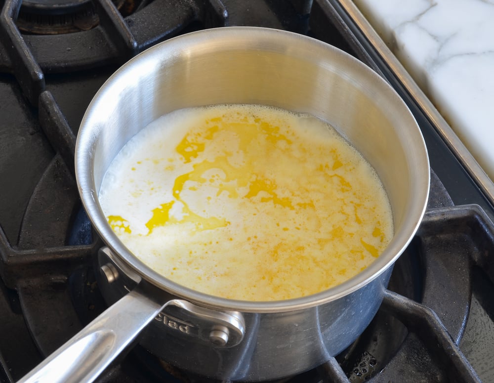 Butter and cream in a pan on the stove.