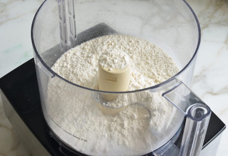Dry pie crust ingredients in a food processor.