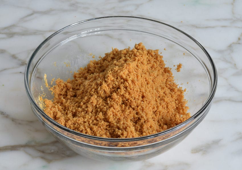 Bowl of graham cracker crumb mixture.