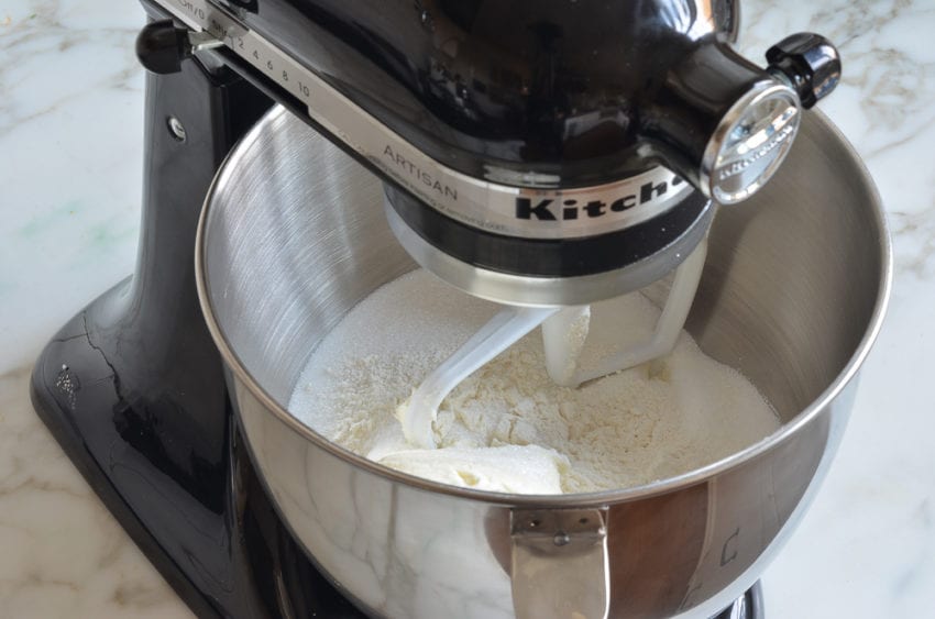 Cream cheese, sugar, and flour in a stand mixer.