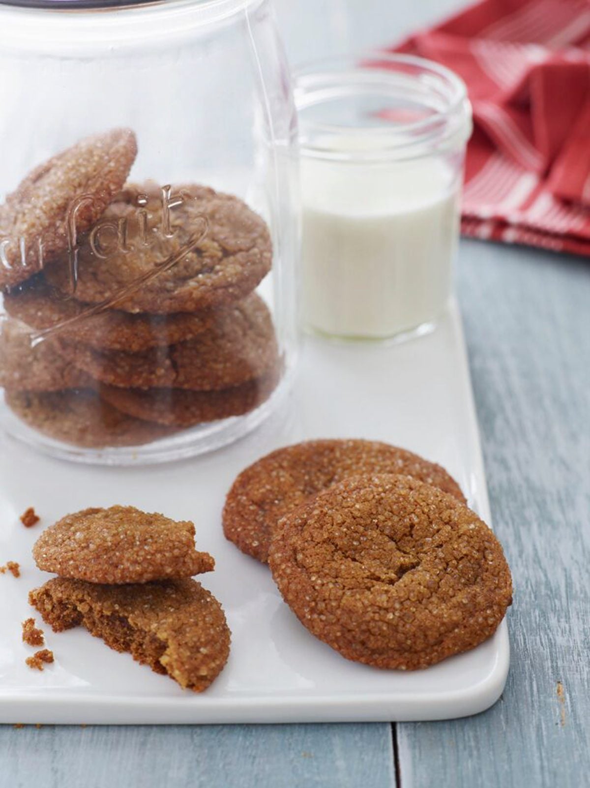 molasses cookies in cookie jar with milk.
