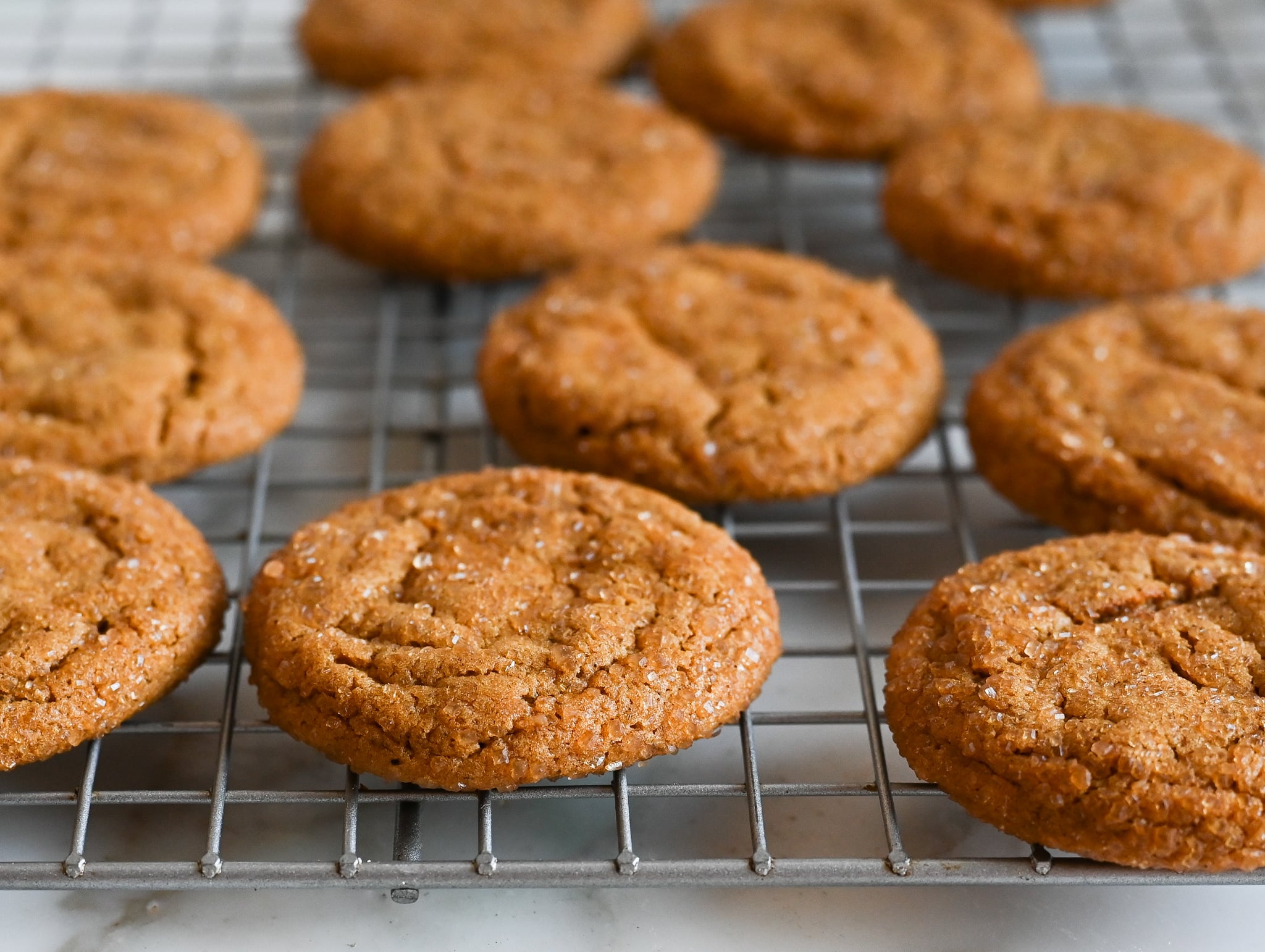 molasses cookies cooling on rack