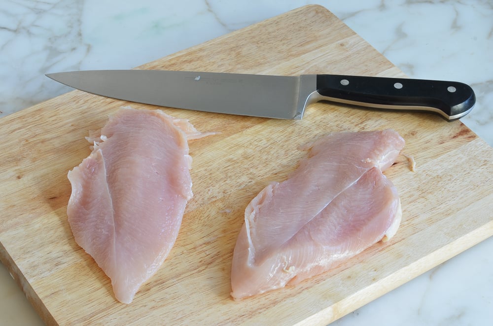 Sliced chicken breast on a cutting board.