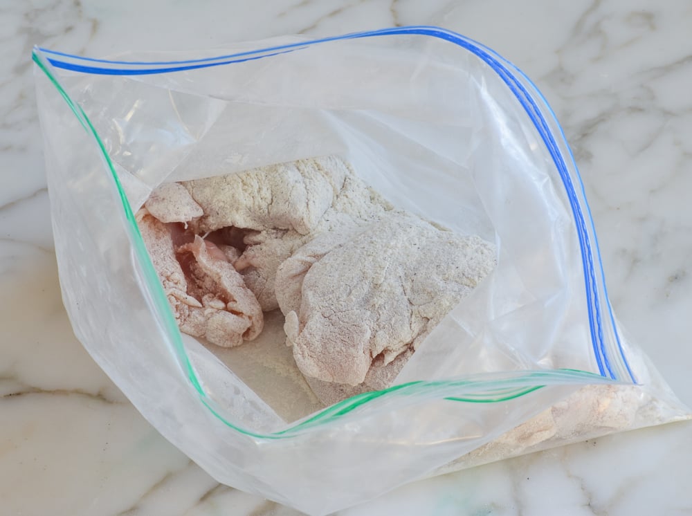 Seasoned chicken in a bag.