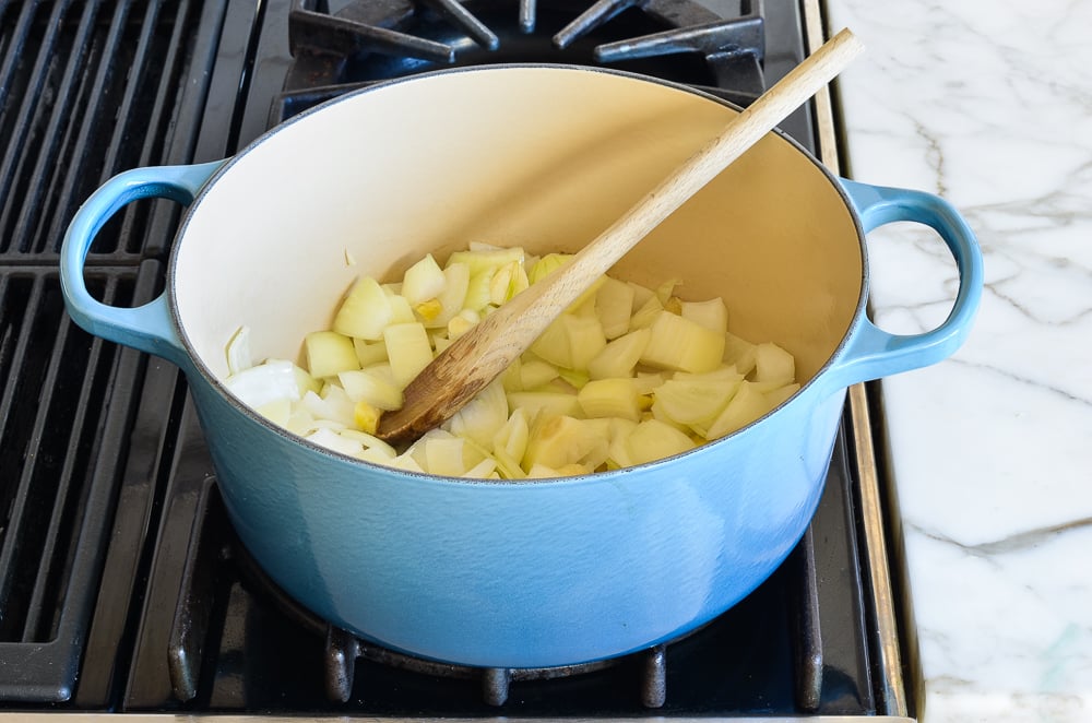 Onion, garlic, and ginger in a Dutch oven.