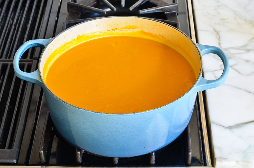 Thai butternut squash soup with coconut milk in a Dutch oven.