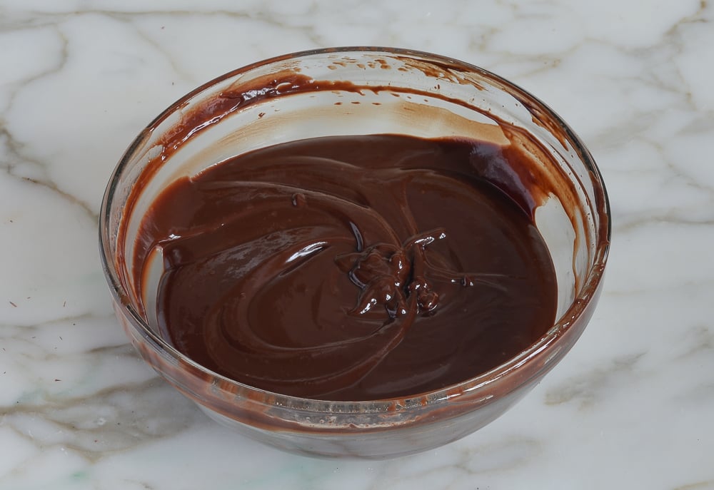 Bowl of glossy chocolate sauce.