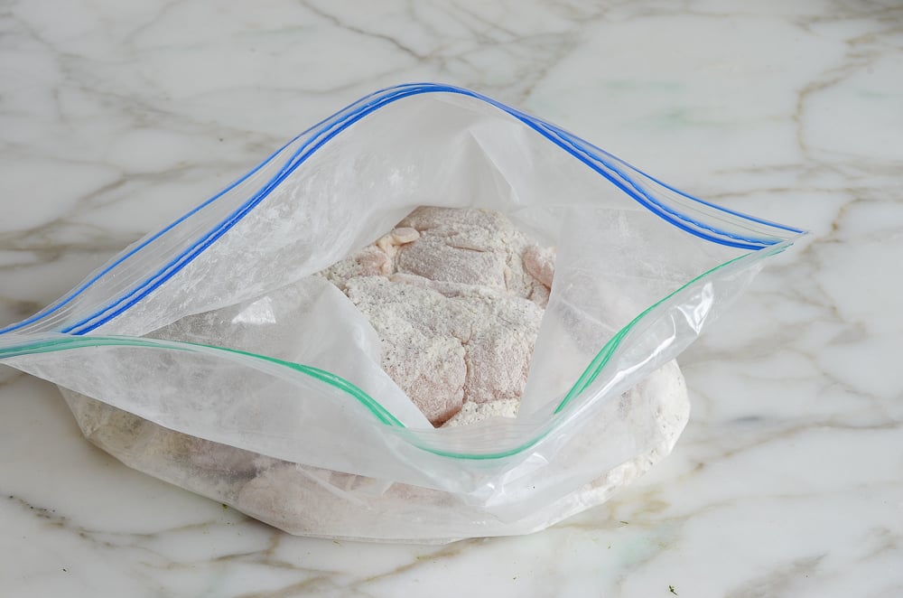 chicken coated with flour in the bag.