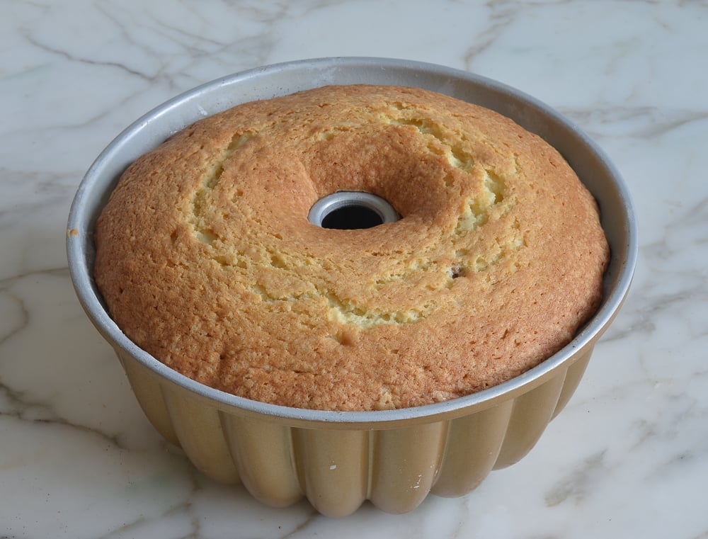 Sour cream coffee cake with cinnamon-walnut swirl in a Bundt pan.