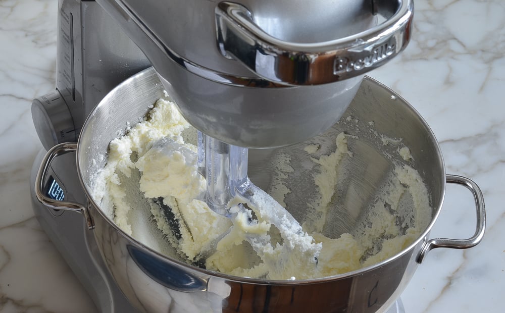 Beaten sugar and butter in a stand mixer.