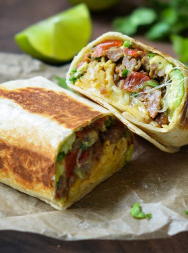 Breakfast Burritos on parchment paper.