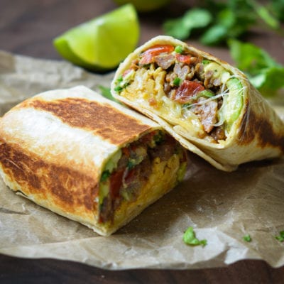 Breakfast Burritos on parchment paper.