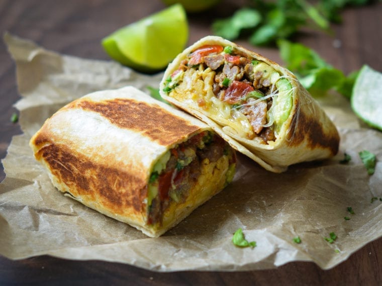 Breakfast Burritos on parchment paper.