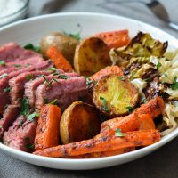 corned beef and cabbage in bowl with horseradish cream sauce on side