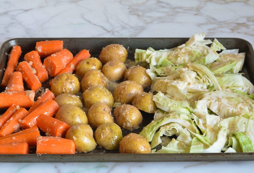 making corned beef and cabbage - vegetables evenly tossed with the horseradish butter