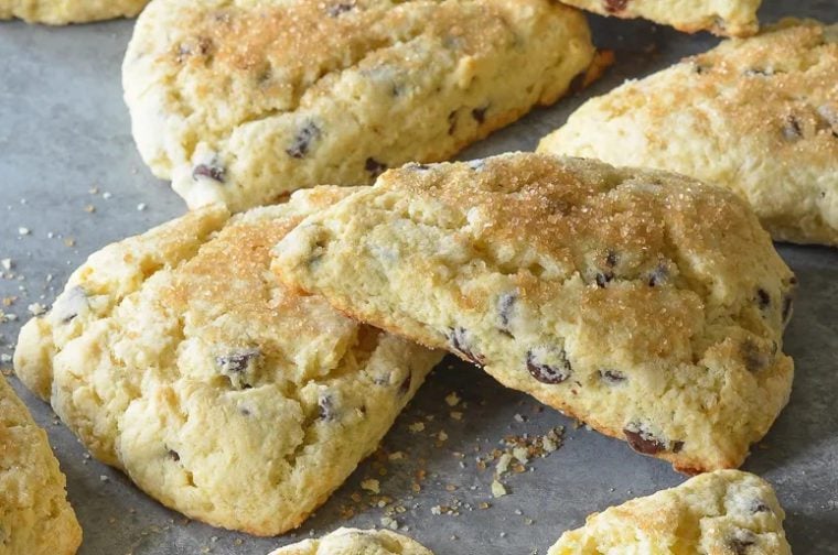 Chocolate chip scones on parchment paper.