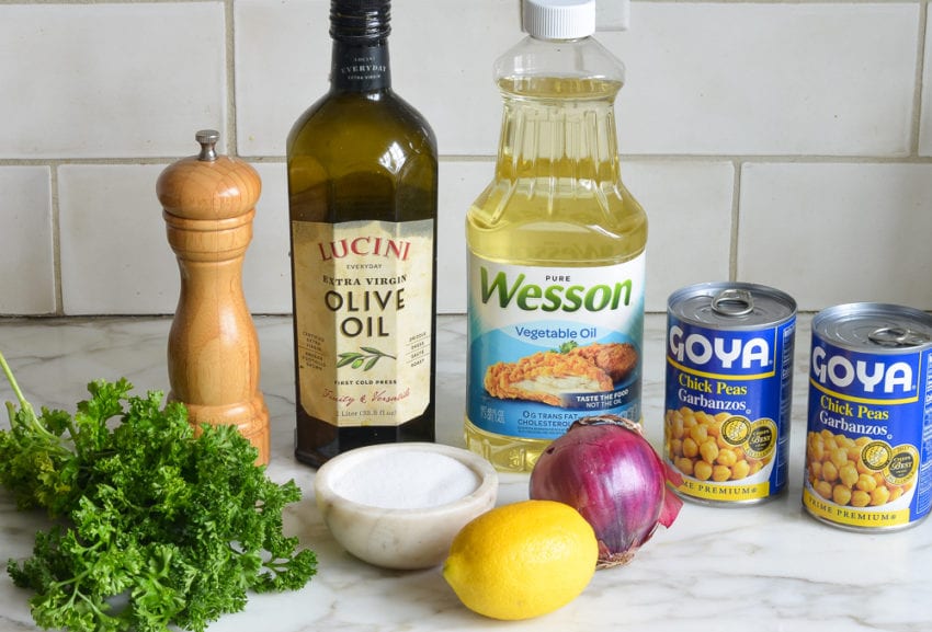 Salad ingredients including olive oil, red onion, and lemon.
