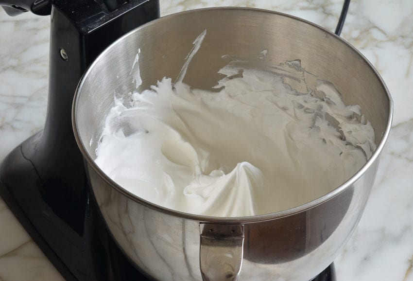 Egg white mixture with a curled peak.
