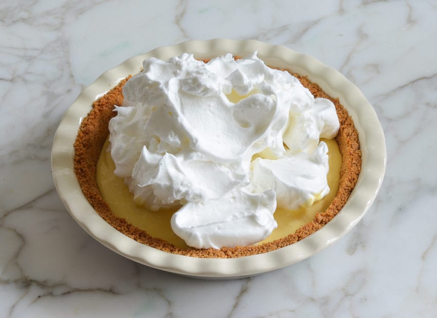 Meringue on wet lemon filling in a pie pan.