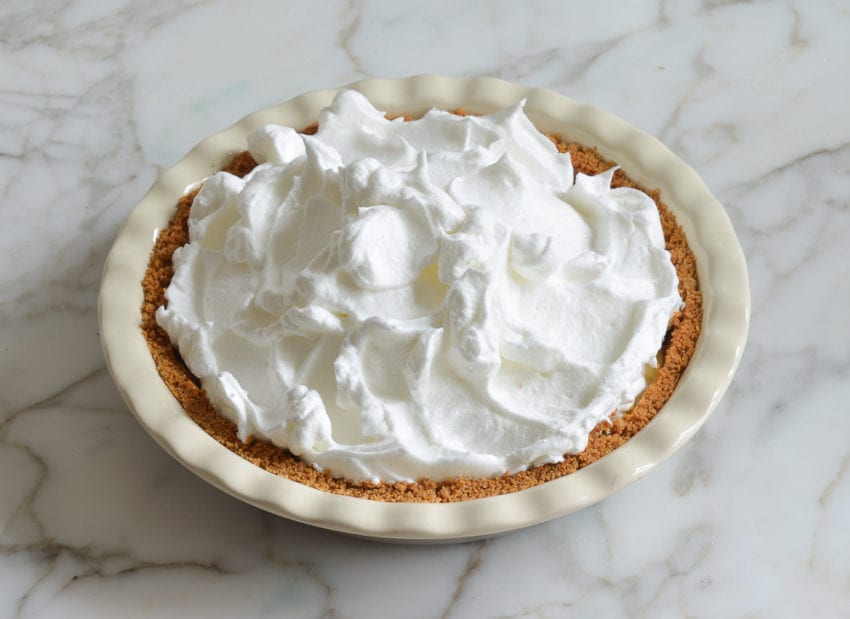 Meringue piled on a lemon pie.