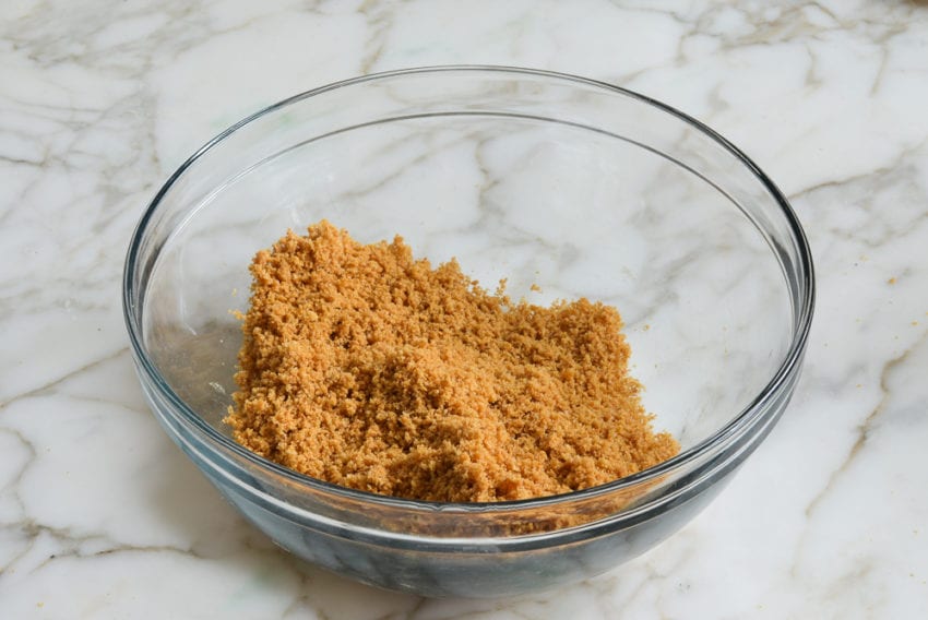 Graham cracker mixture in a bowl.