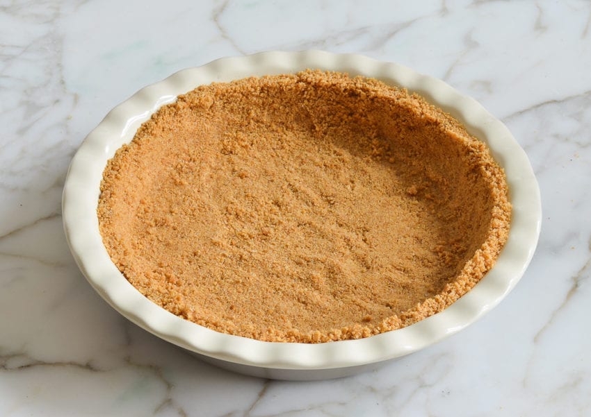 Pie pan with a graham cracker crust.