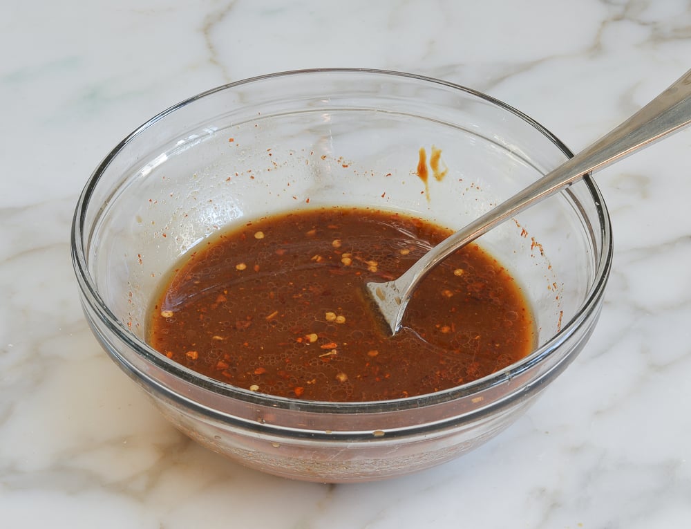 bowl of sauce for kung pao chicken with fork.