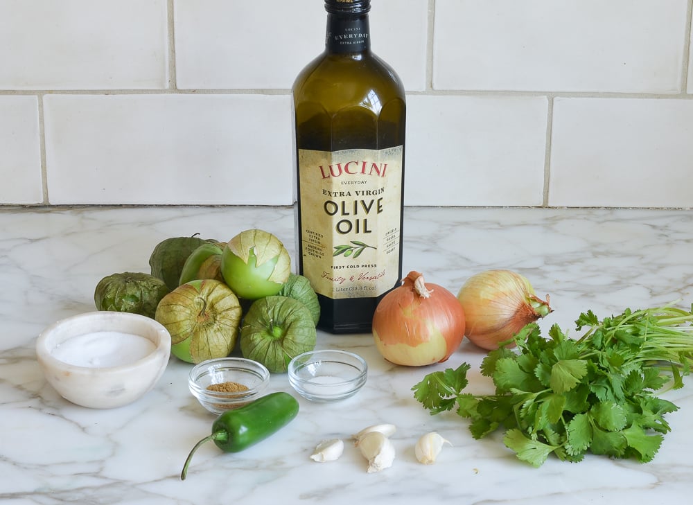 Salsa verde ingredients including onions, olive oil, and garlic.