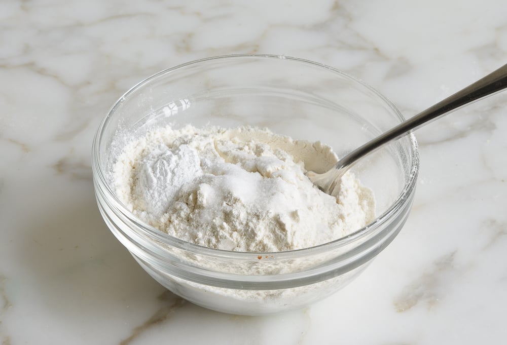 Unmixed dry ingredients in a bowl.