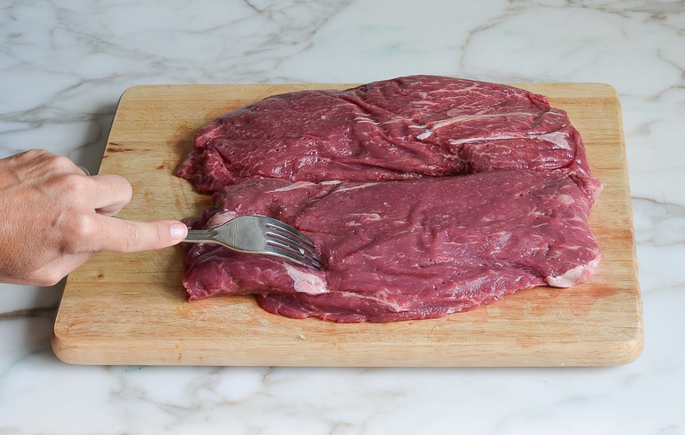 poking Carne Asada with fork