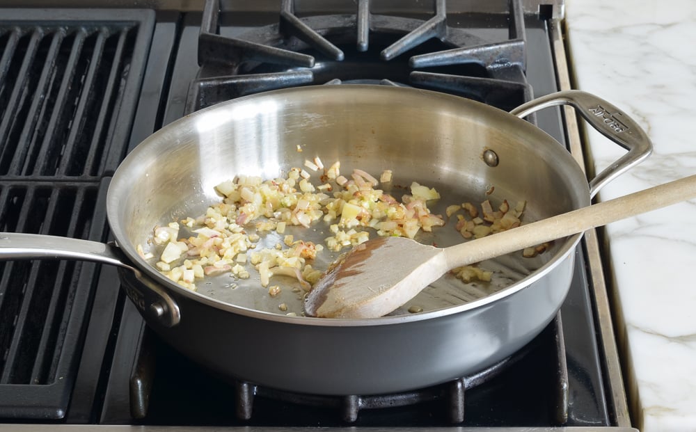 Garlic and shallots in a skillet.