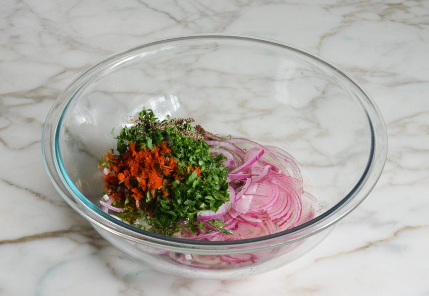 German potato salad vinaigrette ingredients in mixing bowl