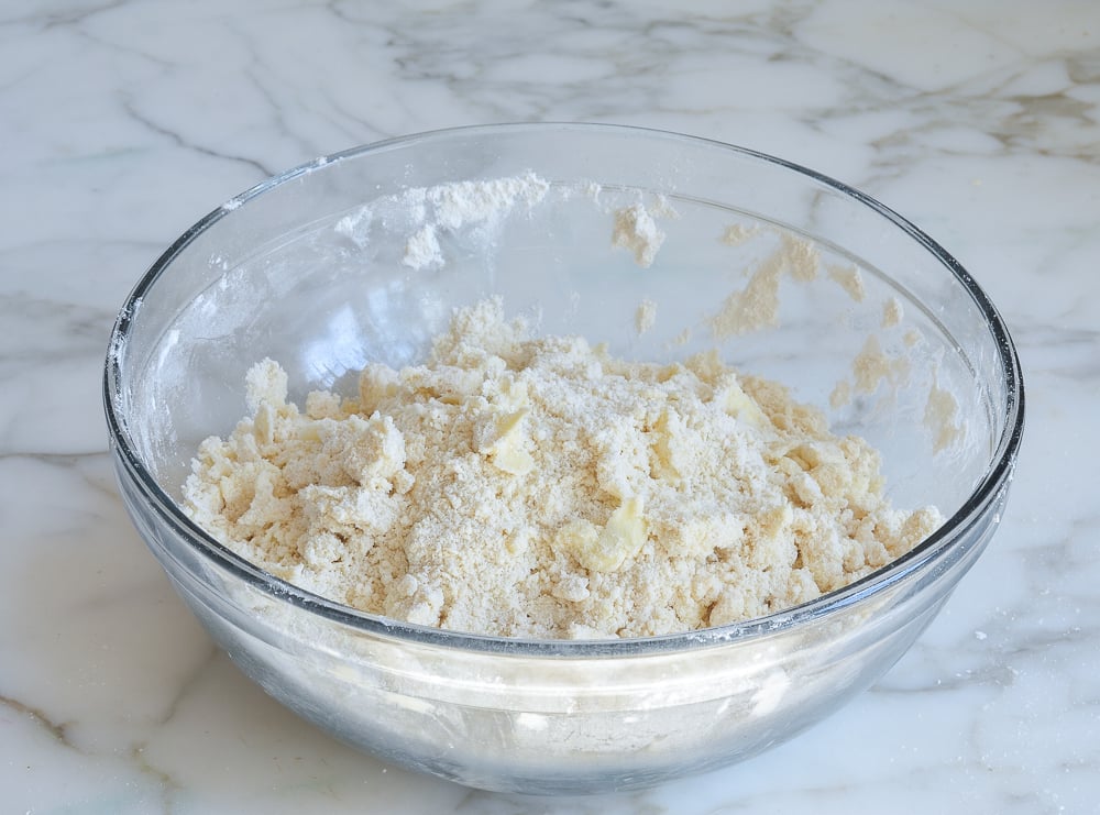Butter rubbed into dry ingredients to create pea-sized clumps.