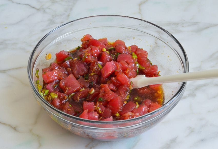 Tuna in a bowl with a soy sauce mixture.