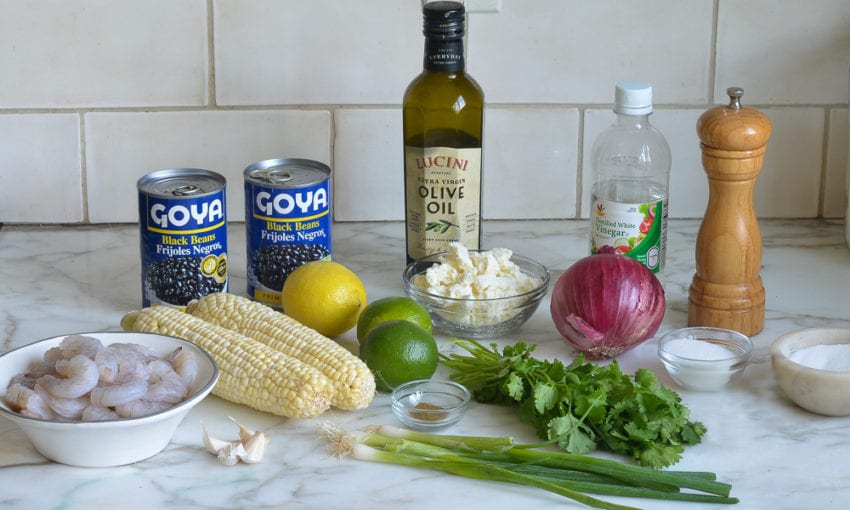 Salad ingredients including black beans, red onion, and olive oil.